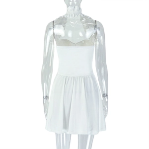 Rear view of white backless halter mini dress on mannequin with pleated A-line detail
