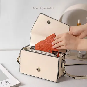 Travel portable cream white PU leather glasses case bag with snap closure and orange charm