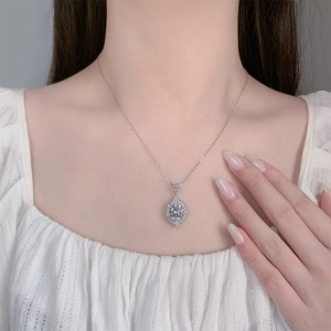 Close-up of 2 carat teardrop zirconia pendant necklace on female model neck