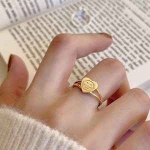 Golden heart smiley face ring with dual band design and beaded texture detail