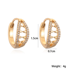 Hollow 18K gold plated hoop earrings with zircons and spikes on white background