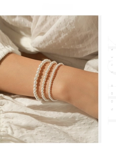 Detailed view of elegant multi-layer s925 silver pearl bracelet worn by a model