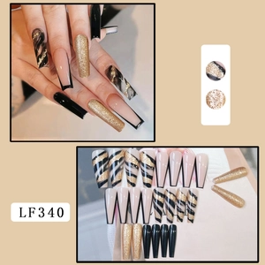 Detailed set of long coffin press-on nails with black marble, gold foil and French tips