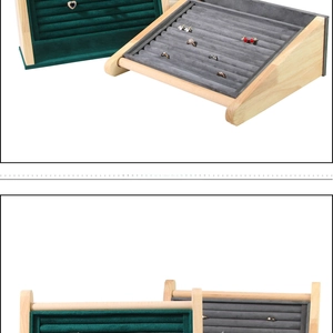 Detail of solid wood jewelry stand with multi-slot velvet lining for rings and studs