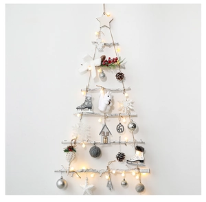 Detail of hanging white birch Christmas tree with LED lights and festive ornaments