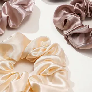Glossy silk satin oversized scrunchies in champagne and pink for women hairstyles