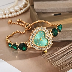 Elegant gold quartz watch with heart green crystals and luxury diamond bezel for women