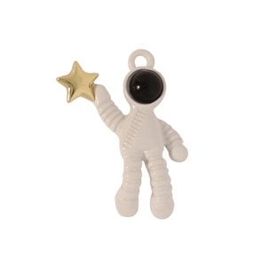 Detail of white astronaut pendant holding a gold star, enamel alloy jewelry charm