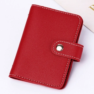 Red lychee pattern leather card holder for women with a secure metal snap closure