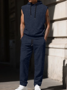 Detail shot of navy marble print sleeveless hoodie and matching joggers on street model