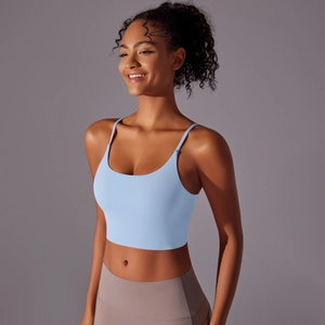 Detail of light blue high-impact sports bra with thin straps and matte nylon fabric