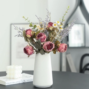 Vintage burnt-edge rose daisy bouquet in white ceramic vase for elegant home table decor