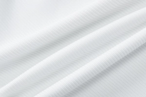 Close-up of white ribbed knit fabric showing soft texture and vertical weaving detail