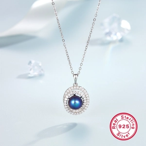 Detailed macro view of S925 sterling silver necklace featuring a deep blue pearl pendant