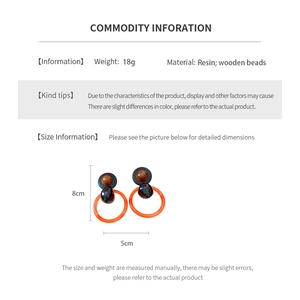 Detailed size and material specification chart for geometric resin and wooden bead earrings