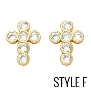 Close-up of golden cross stud earrings with clear round cubic zirconia inlay details