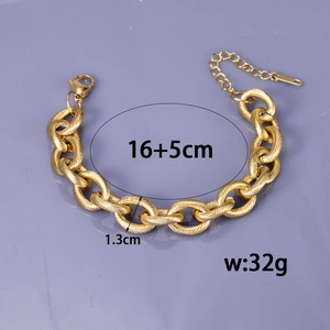 Chunky 13mm gold stainless steel chain bracelet with twisted texture and lobster clasp