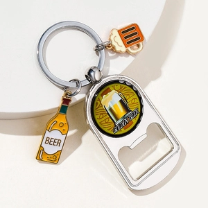 Detail of beer bottle opener keychain featuring metal charms and Golden Beer logo