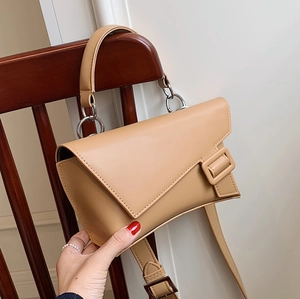 Minimalist khaki leather belt bag for women with asymmetrical flap and silver metal ring