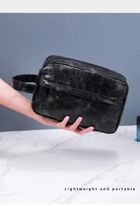 Close-up of premium black PU leather toiletry bag with vintage texture and side handle