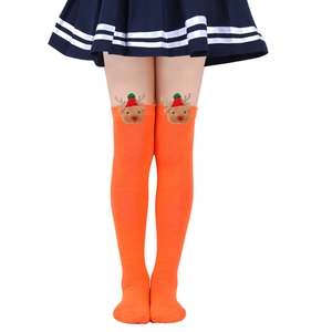 Detail of orange knee-high Christmas socks for kids with cute reindeer doll decoration