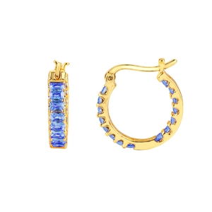 Macro detail of 18K gold-plated hoop earrings featuring rectangular blue cubic zirconia