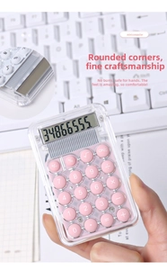 Close-up of a pink mini calculator with transparent body and round tactile buttons