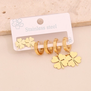 Three-pair gold stainless steel earring set featuring clover studs and hoop charms