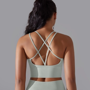 Detailed back view of sage green seamless ribbed sports bra with crisscross straps