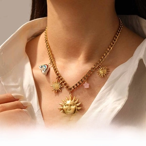 Gold plated stainless steel necklace set with sun face and rainbow charms on Cuban chain