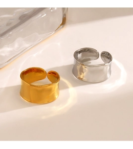 Detailed macro view of gold and silver chunky textured rings with hammered surface