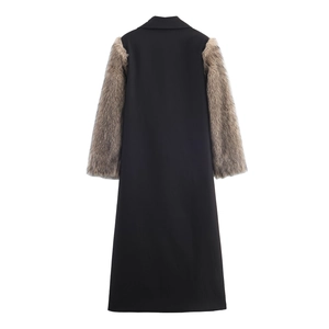 Women's long black coat with brown faux fur sleeves in a modern streetwear style
