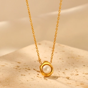 Minimalist 18K gold plated pearl necklace with irregular textured pendant on stone