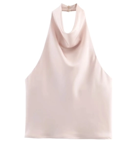 Detail of champagne satin halter top showing cowl neck and smooth silk texture