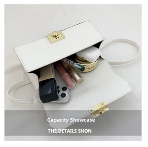 Interior view showing the large capacity of a white crossbody bag with small essentials
