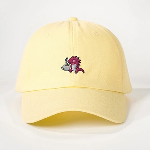 Vintage adjustable beige baseball cap featuring a cute cartoon dinosaur embroidery