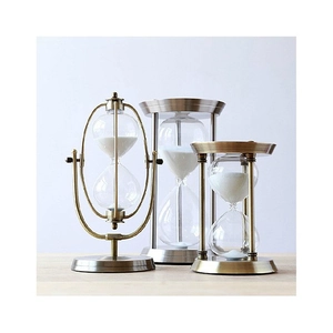 Set of vintage brass metal sand timers in three sizes for home and office decoration