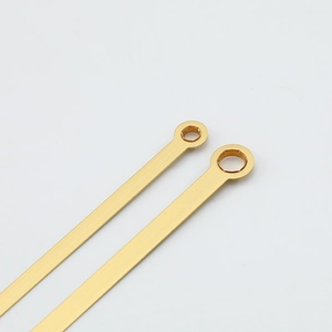Polished gold quartz clock hands with brushed finish and circular mounting hole