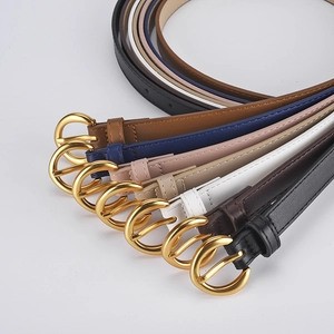 Women's minimalist leather belts with round gold buckles in various fashion colors