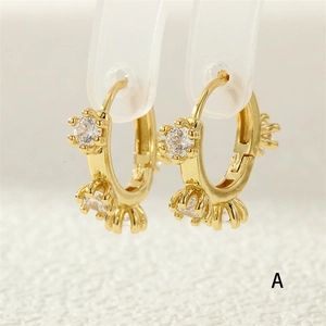 Detailed close-up of 18K gold plated hoop earrings with white zircon stone settings