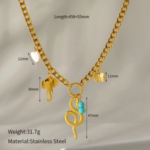 Detail of stainless steel gold necklace with heart elephant snake and butterfly pendants