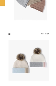 Detail of multi-color thick knit beanies with fluffy pompom and folded patchwork brim