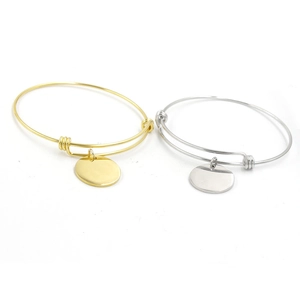 Adjustable wire bangle set in gold and silver with blank round charms for engraving