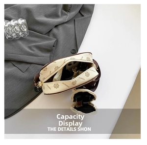 Internal view of cream crossbody bag set showing spacious storage for makeup and phone