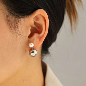 Polished silver sphere and white pearl drop earrings for women in a minimalist style