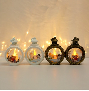 Close-up of four LED Christmas lanterns featuring Santa and Snowman holiday patterns
