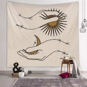Detailed view of bohemian wall tapestry featuring celestial sun and moon line art