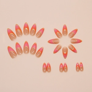 Almond press-on nails featuring pink gradient design with thin gold metallic lines