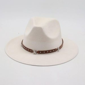 Detail of white fedora hat with star studded dark brown leather decorative band