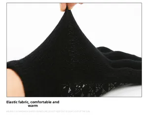 Close-up of black tactical knit gloves showing elastic fabric and anti-slip palm grip